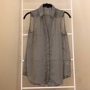 Sleeveless sheer black and white collared blouse